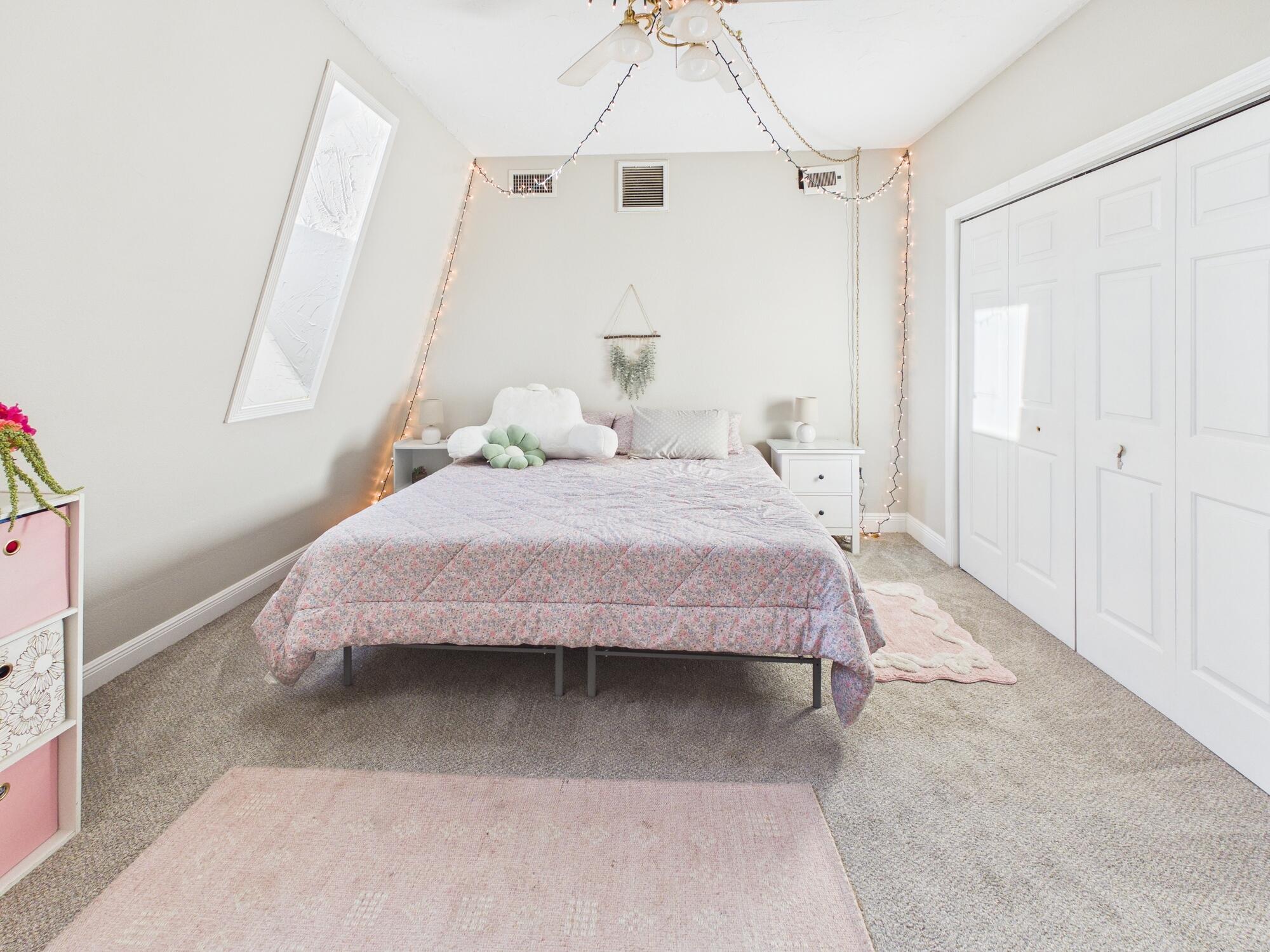 755 Southwest 85th Avenue Okeechobee, FL 34974 - Photo 75 of 99 a bedroom with a bed and a chandelier