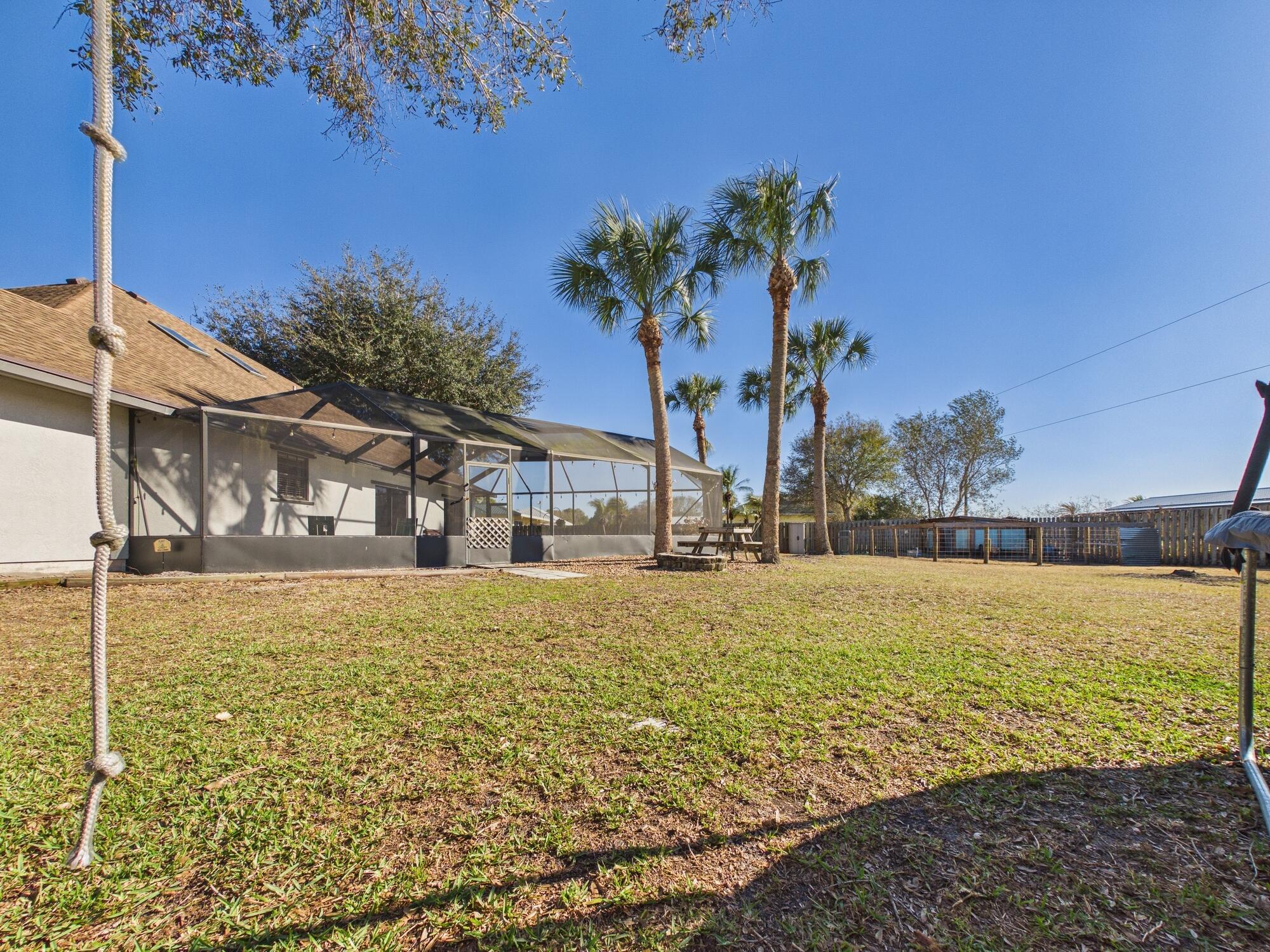 755 Southwest 85th Avenue Okeechobee, FL 34974 - Photo 85 of 99 a front view of a house with a yard