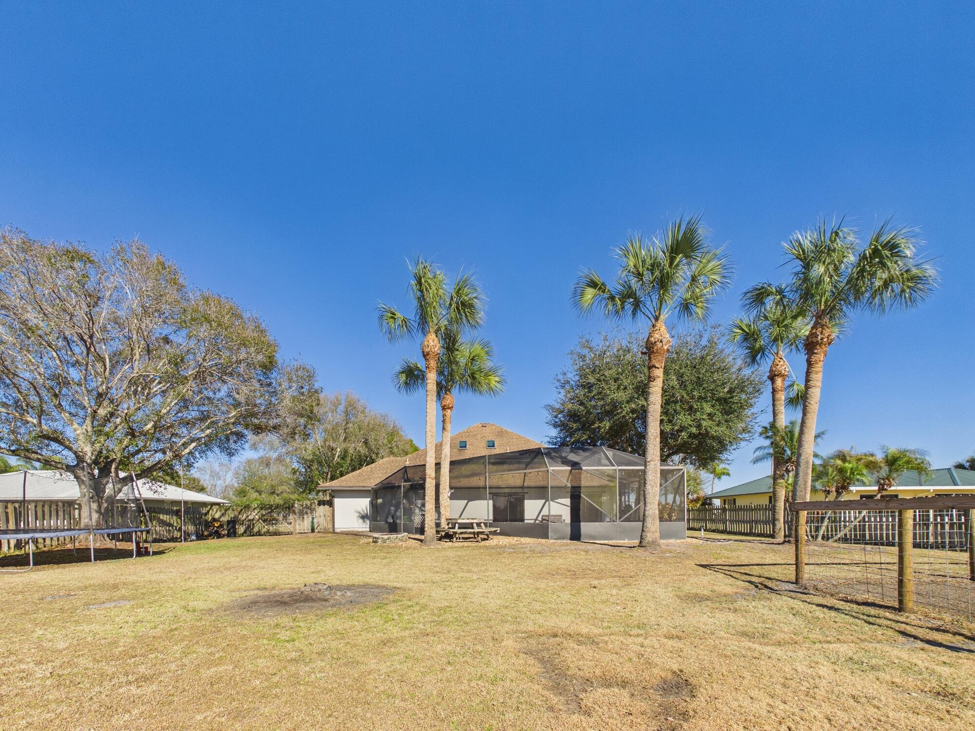 755 Southwest 85th Avenue Okeechobee, FL 34974 - Photo 88 of 99 a view of a house with a snow yard and mountain view