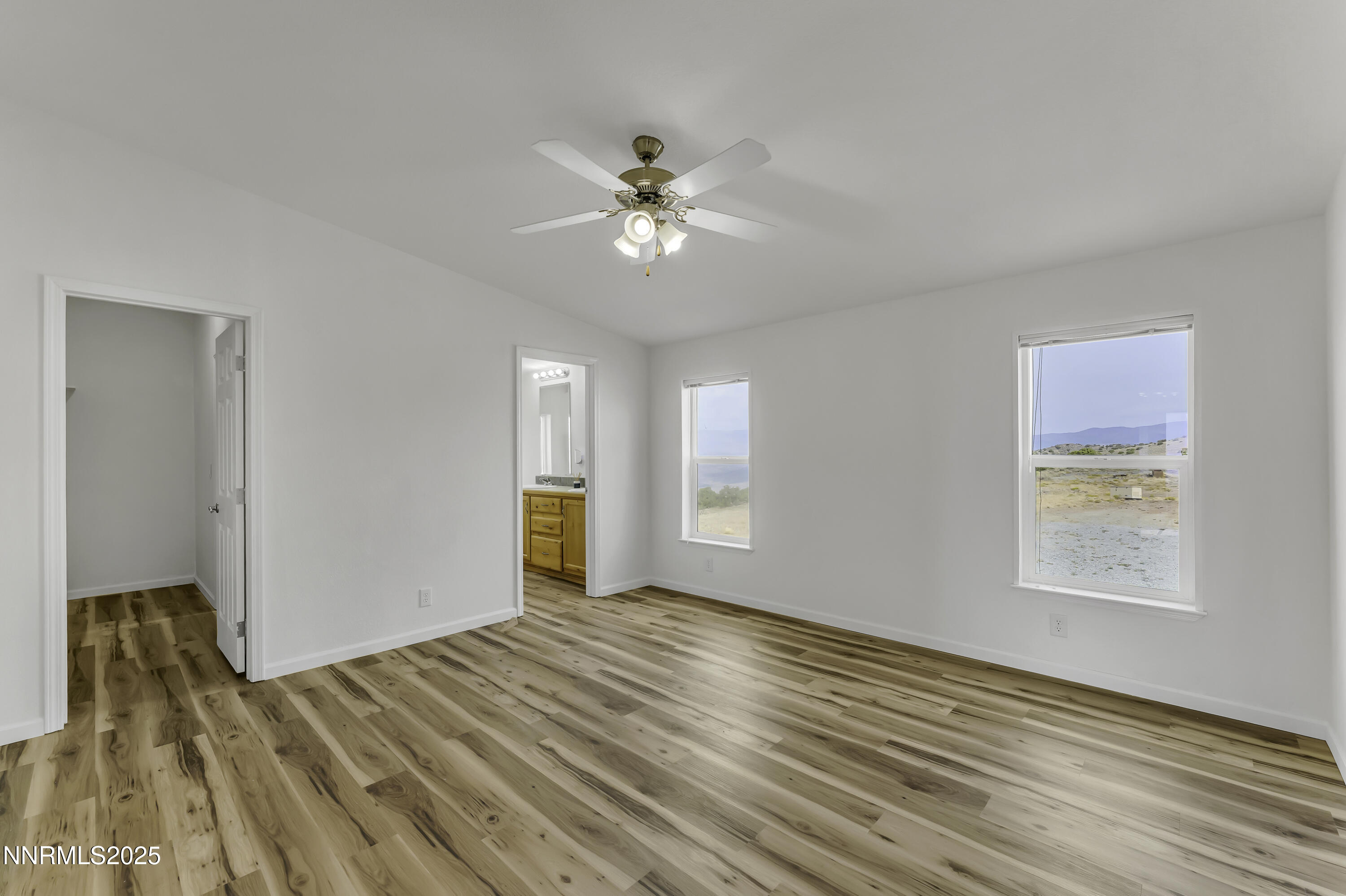 90 Curnow Canyon Road Reno, NV 89510 - Photo 17 of 63 a view of empty room with wooden floor and fan