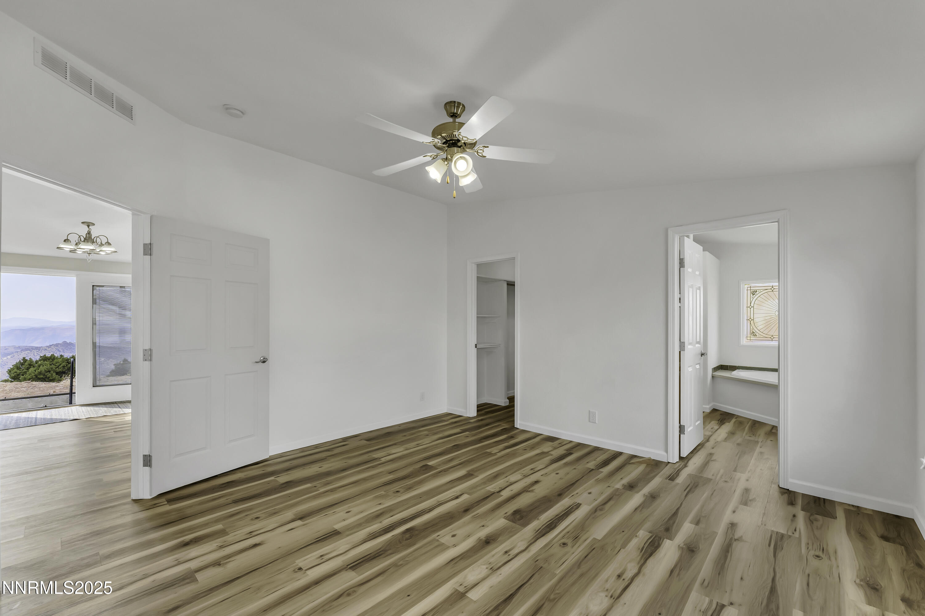 90 Curnow Canyon Road Reno, NV 89510 - Photo 18 of 63 a view of empty room with wooden floor