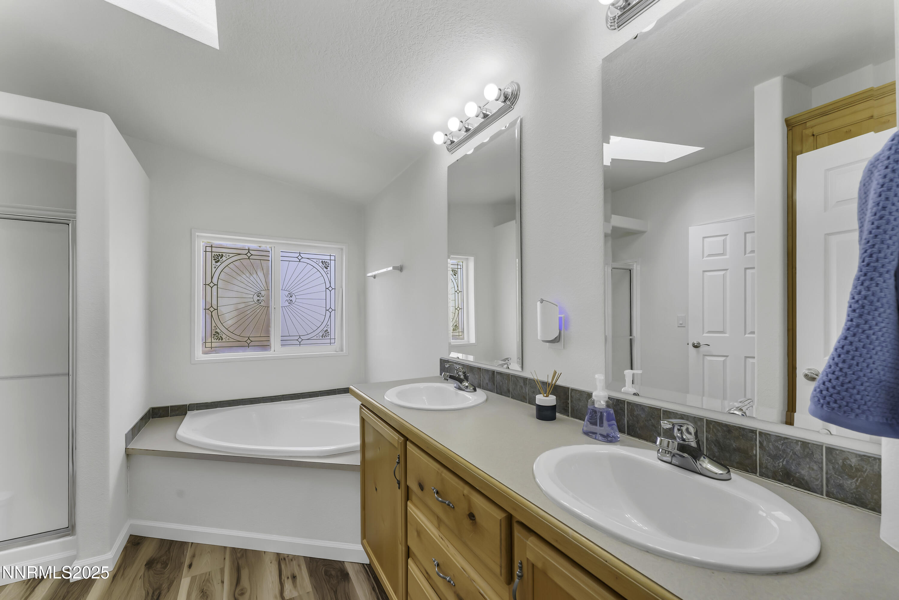 90 Curnow Canyon Road Reno, NV 89510 - Photo 19 of 63 a bathroom with a granite countertop sink tub and a mirror