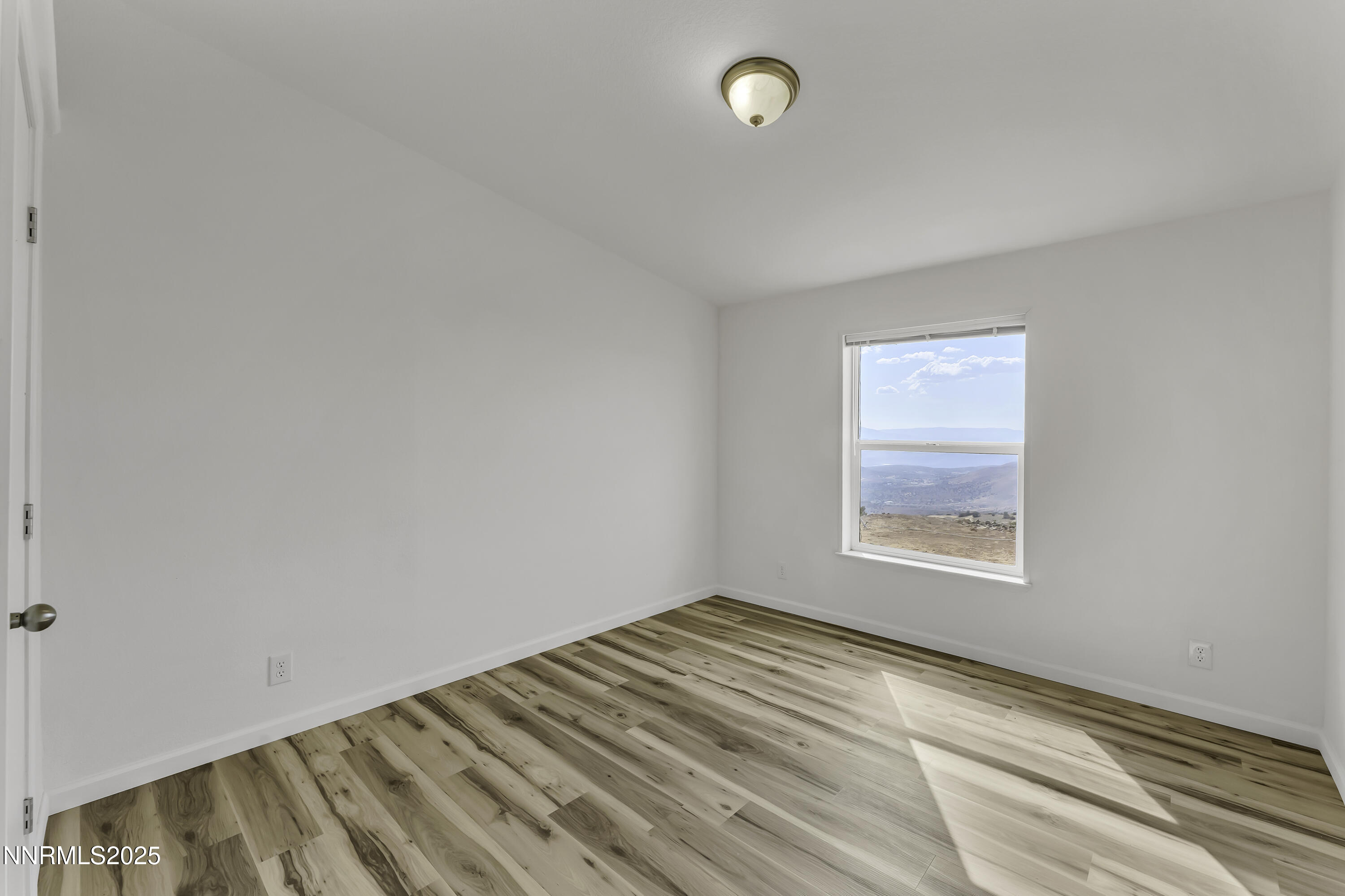 90 Curnow Canyon Road Reno, NV 89510 - Photo 20 of 63 an empty room with a window