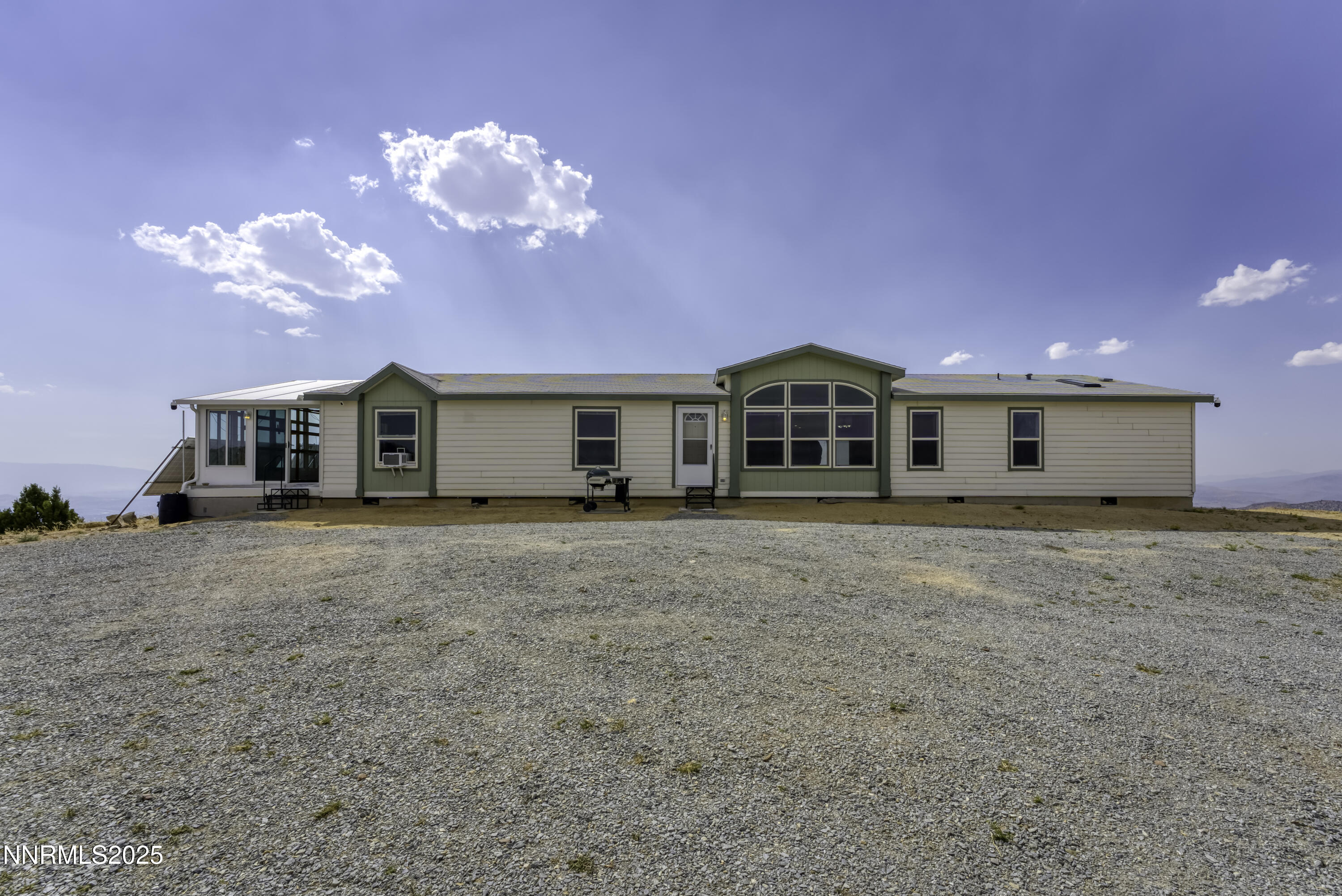 90 Curnow Canyon Road Reno, NV 89510 - Photo 2 of 63 a view of a house with a yard and balcony