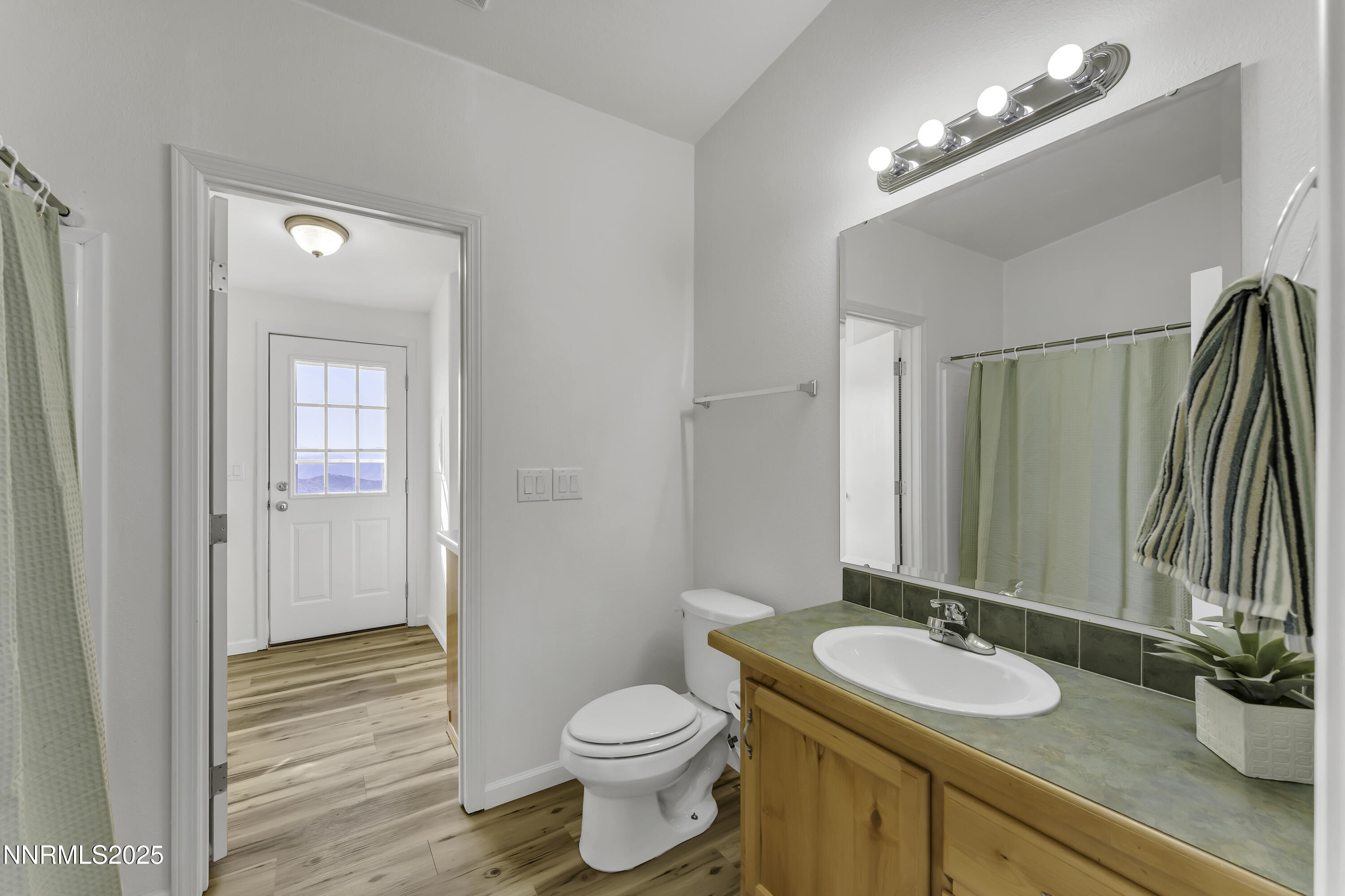 90 Curnow Canyon Road Reno, NV 89510 - Photo 21 of 63 a bathroom with a toilet a sink and mirror