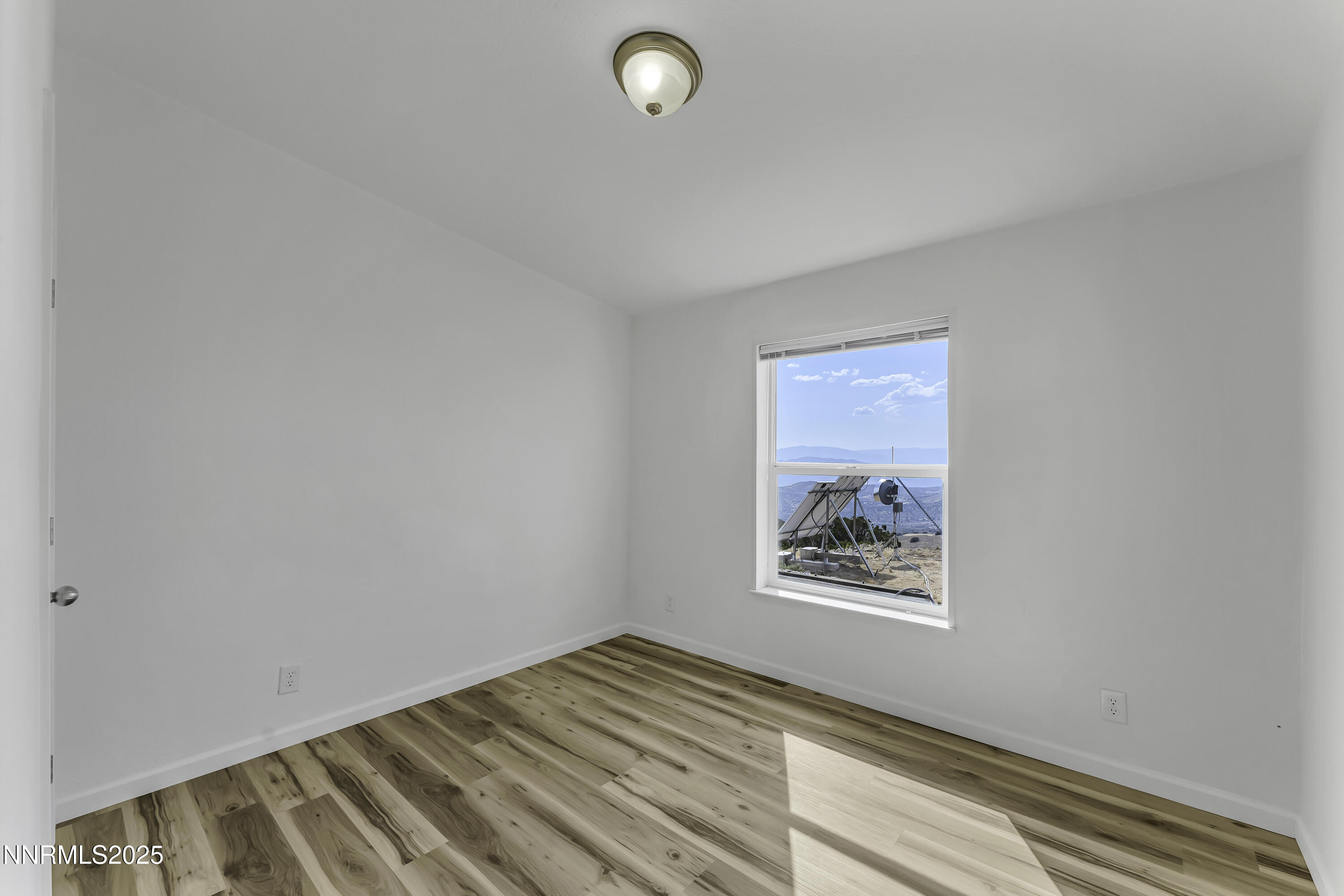 90 Curnow Canyon Road Reno, NV 89510 - Photo 23 of 63 a view of an empty room and window
