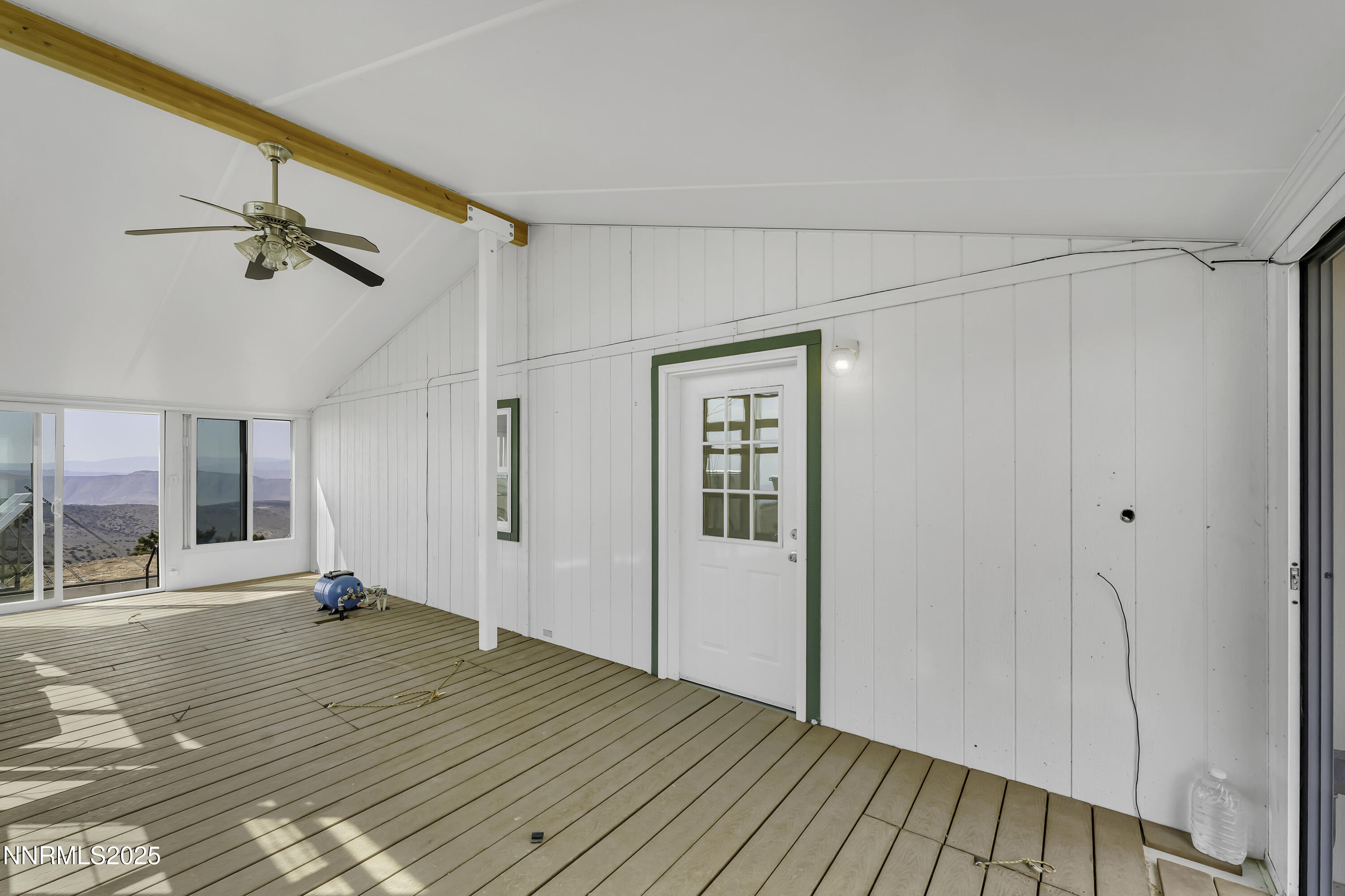90 Curnow Canyon Road Reno, NV 89510 - Photo 29 of 63 a view of a room with wooden floor and a ceiling fan