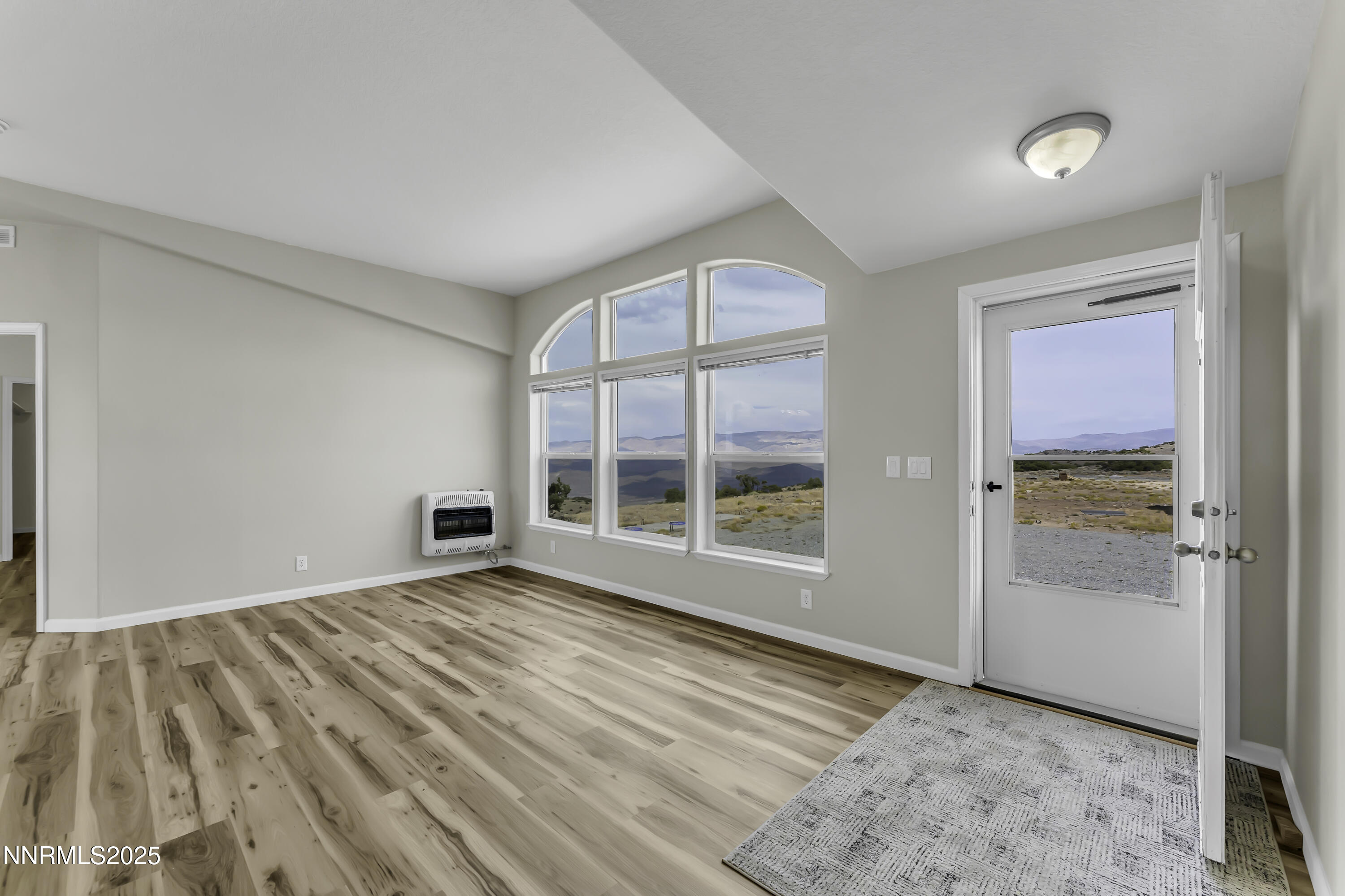 90 Curnow Canyon Road Reno, NV 89510 - Photo 3 of 63 an empty room with windows