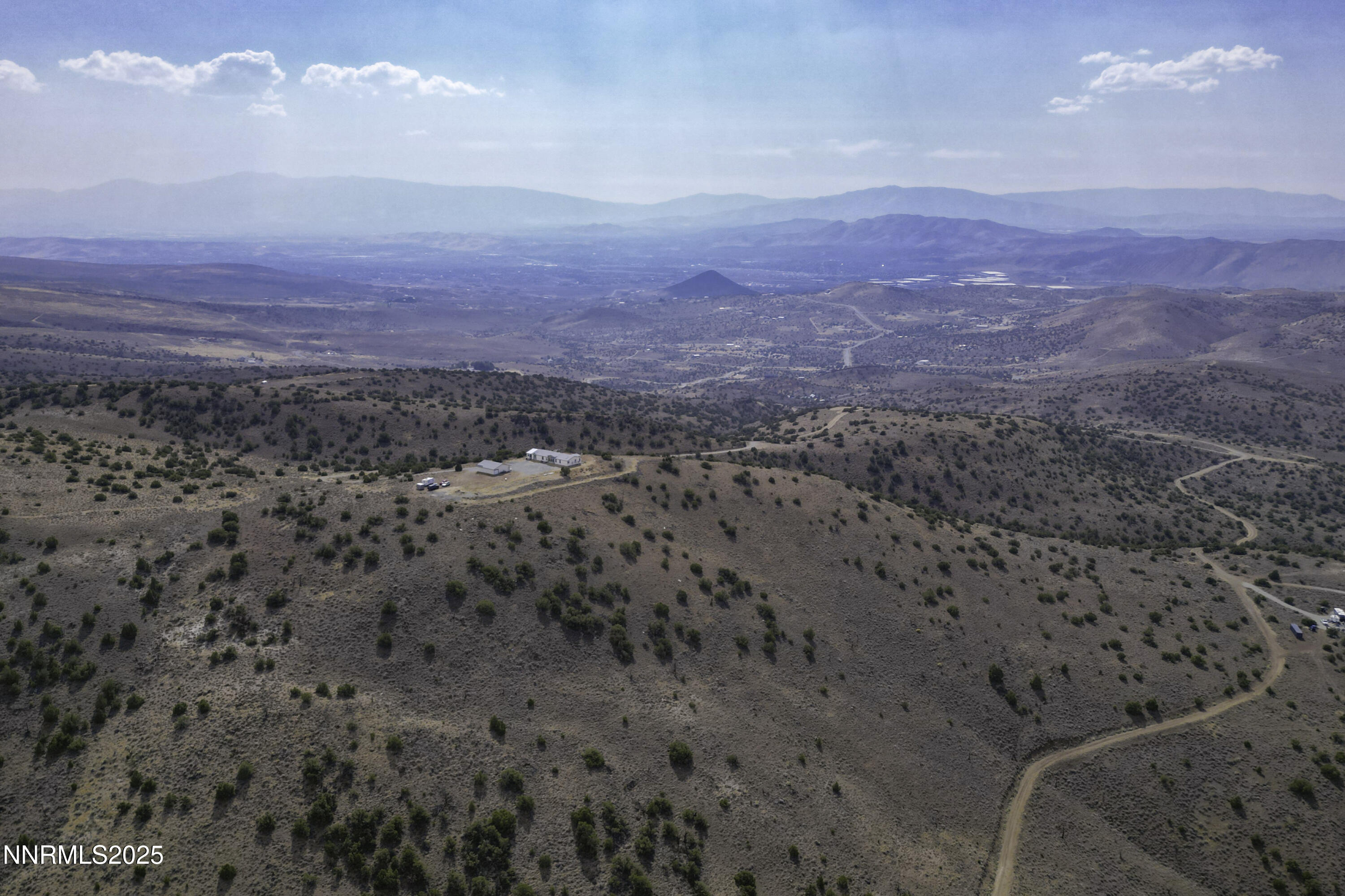 90 Curnow Canyon Road Reno, NV 89510 - Photo 49 of 63 a view of a dry field with mountains in the background