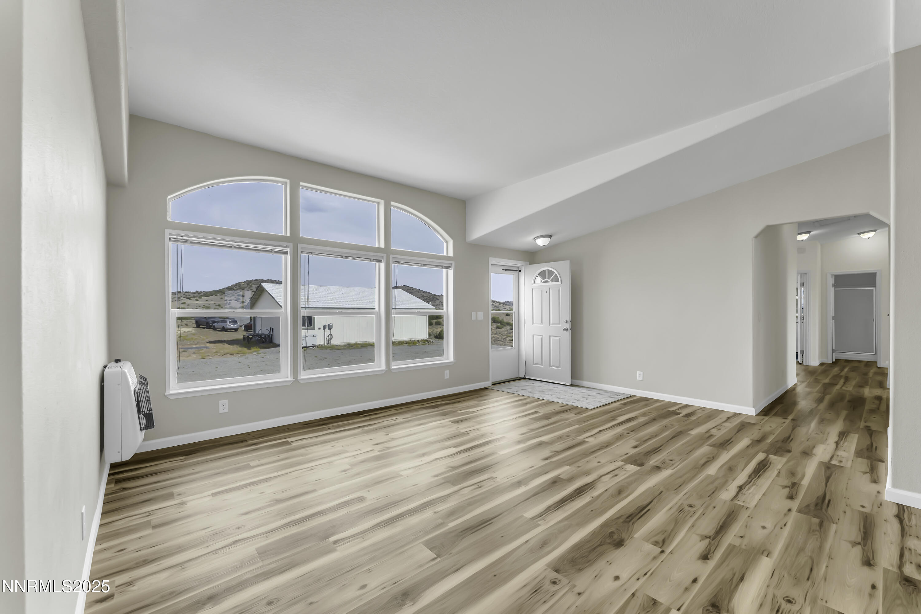 90 Curnow Canyon Road Reno, NV 89510 - Photo 5 of 63 a view of empty room with wooden floor and fan