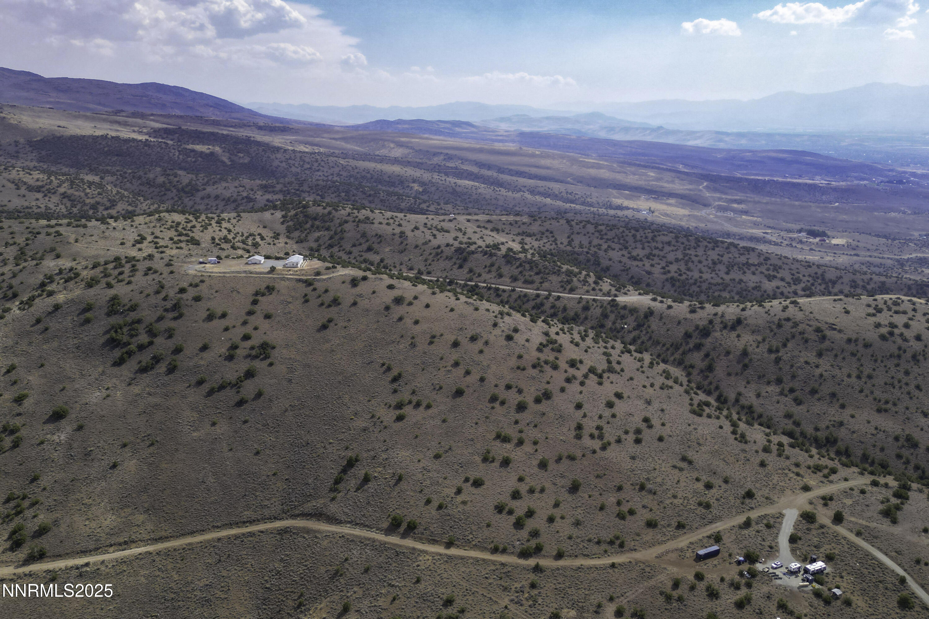 90 Curnow Canyon Road Reno, NV 89510 - Photo 51 of 63 a view of a dry yard with mountains in the background