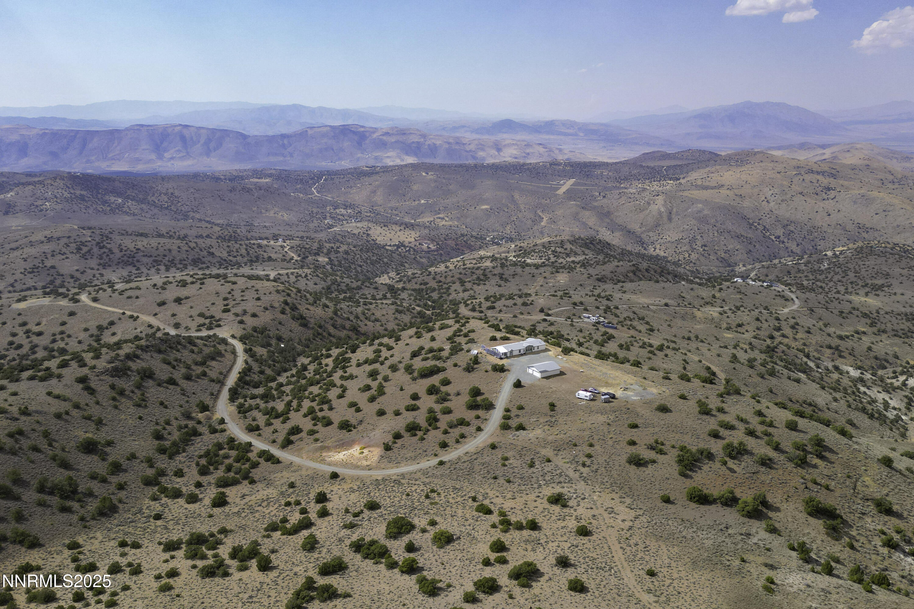 90 Curnow Canyon Road Reno, NV 89510 - Photo 59 of 63 a view of a dry yard with mountains and green space