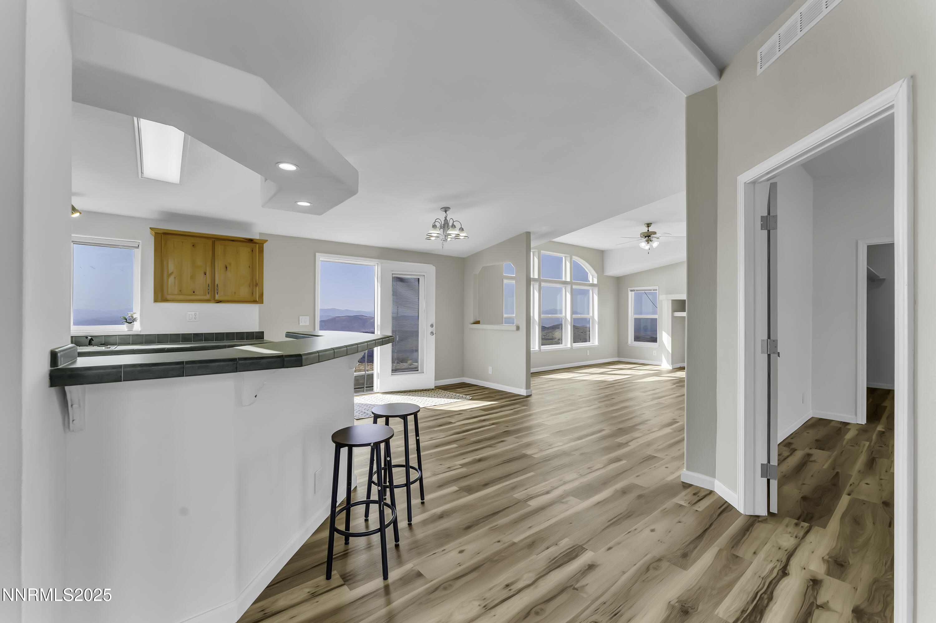90 Curnow Canyon Road Reno, NV 89510 - Photo 6 of 63 a kitchen with stainless steel appliances granite countertop a refrigerator a stove and a wooden floors