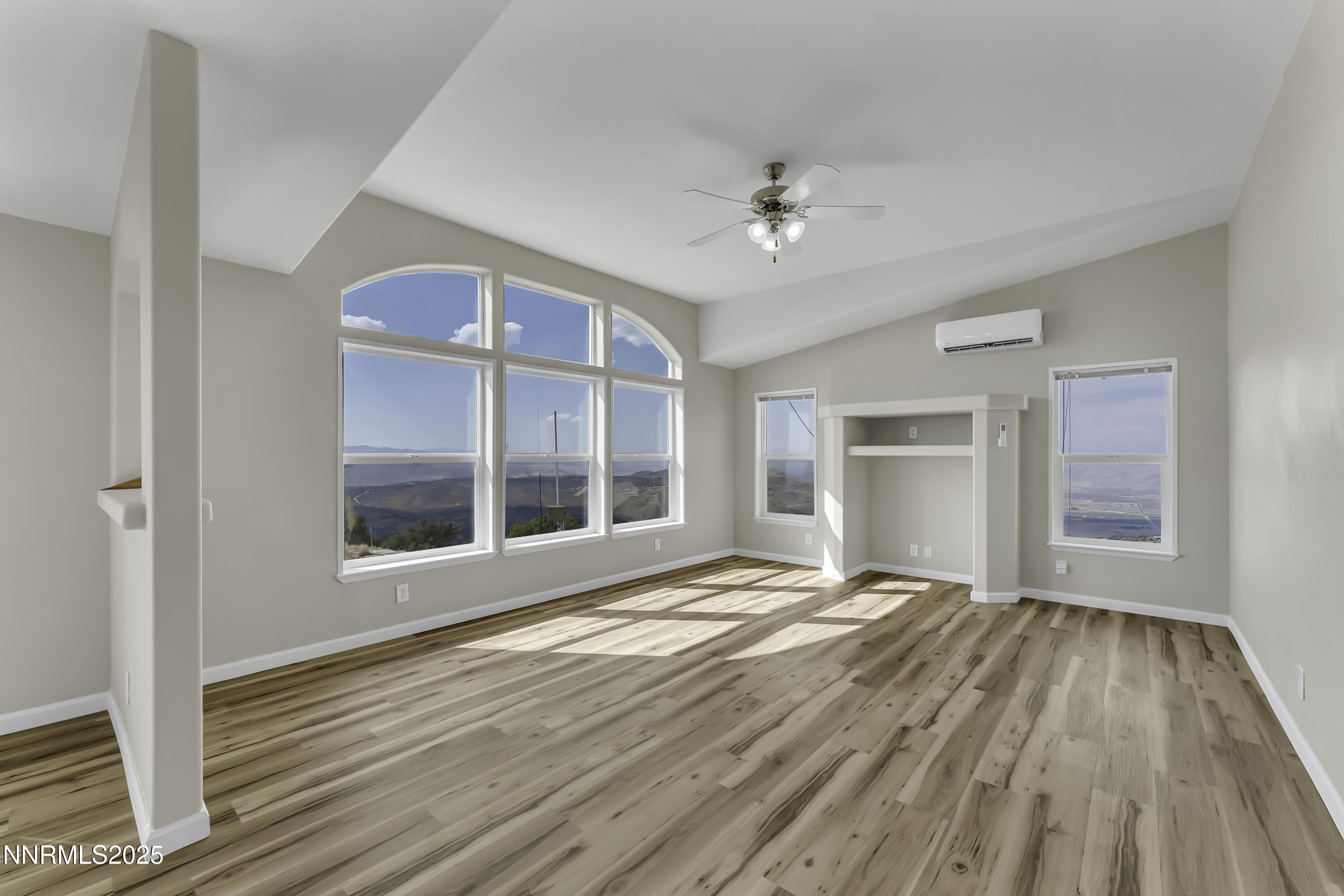 90 Curnow Canyon Road Reno, NV 89510 - Photo 7 of 63 a view of an empty room with a window and wooden floor