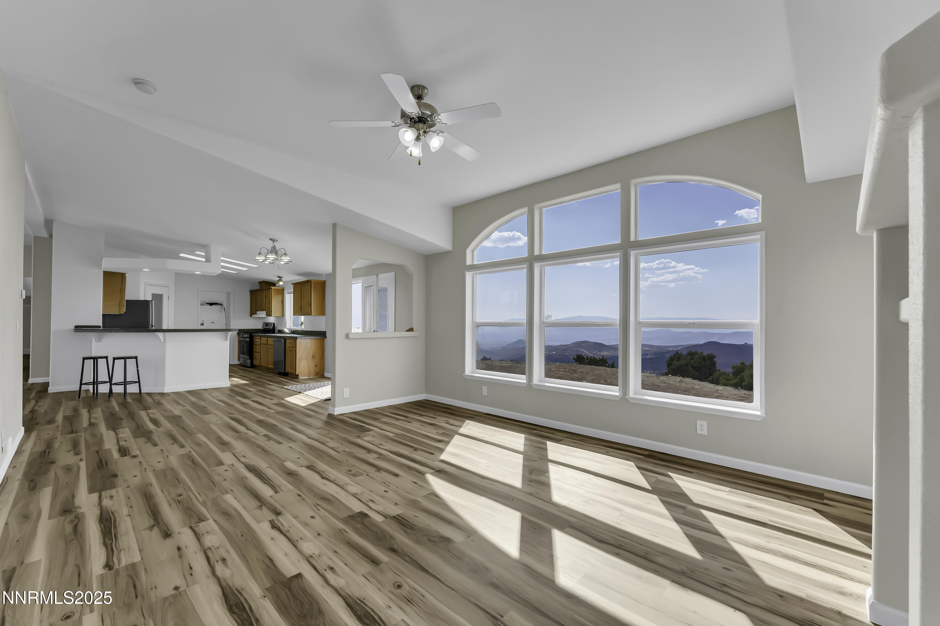 90 Curnow Canyon Road Reno, NV 89510 - Photo 9 of 63 a view of a bedroom with wooden floor and a window