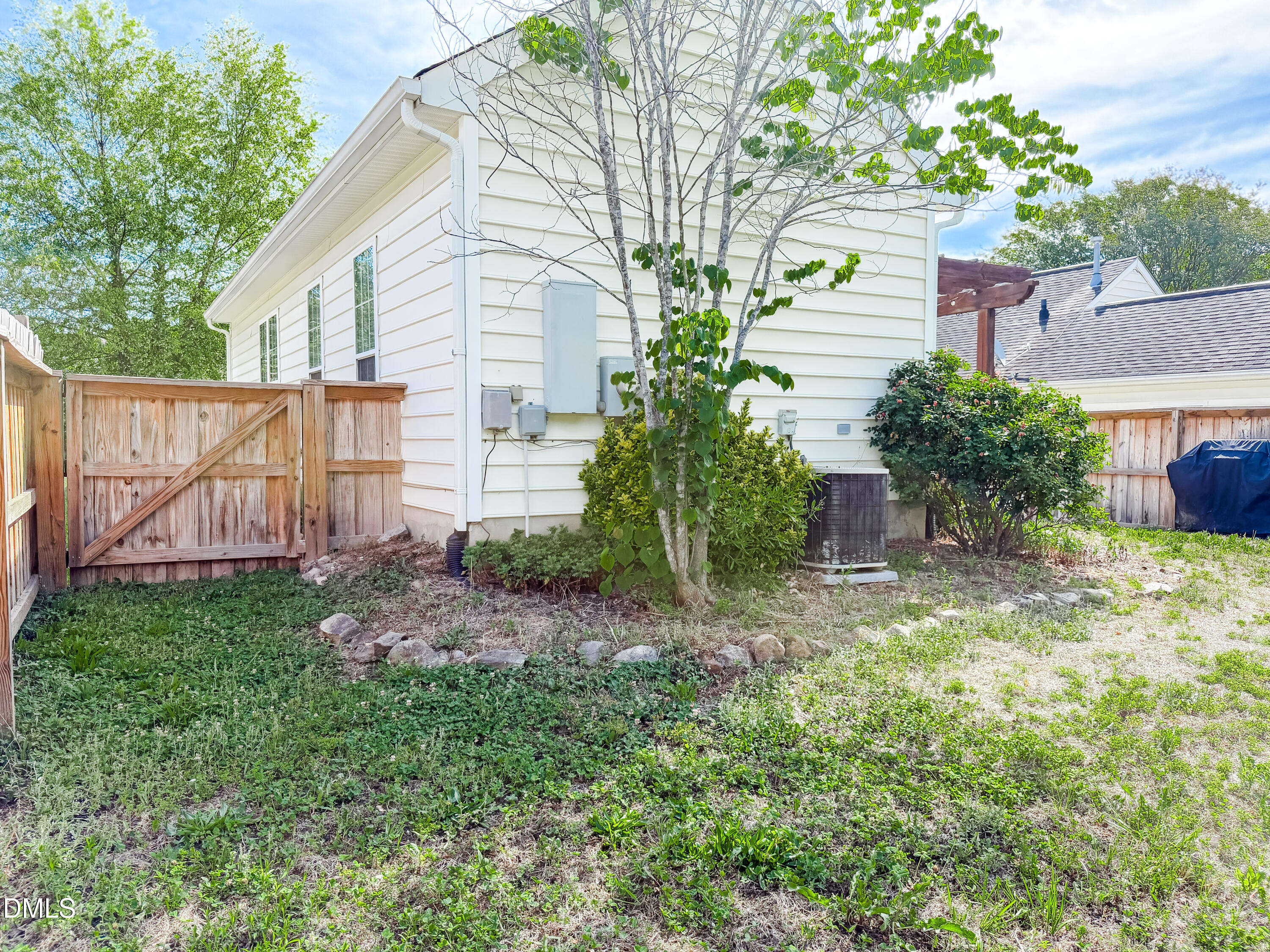 6304 Forest Ridge Drive Durham, NC 27713 - Photo 23 of 29 a backyard of a house with lots of green space