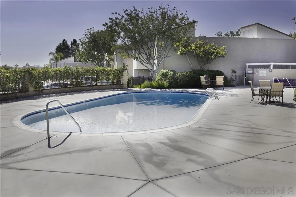 3583 Ruffin Road, Unit 214 San Diego, CA 92123 - Photo 12 of 12 a swimming pool with outdoor seating and yard