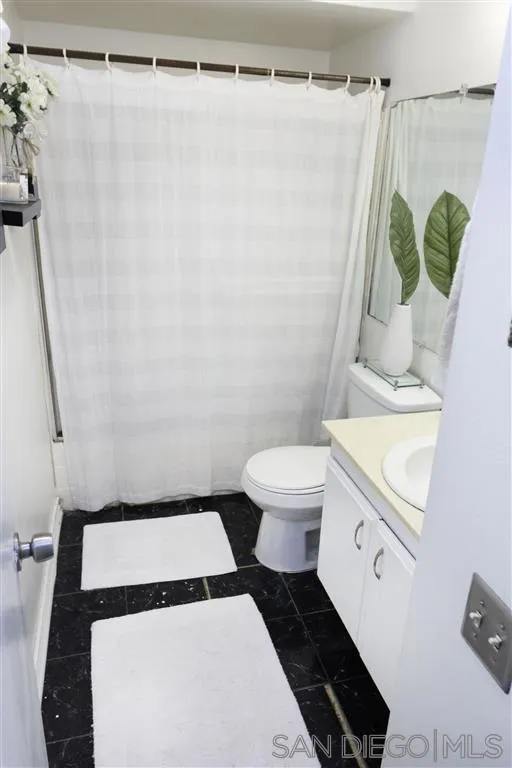 3583 Ruffin Road, Unit 214 San Diego, CA 92123 - Photo 5 of 12 a bathroom with a sink and a shower
