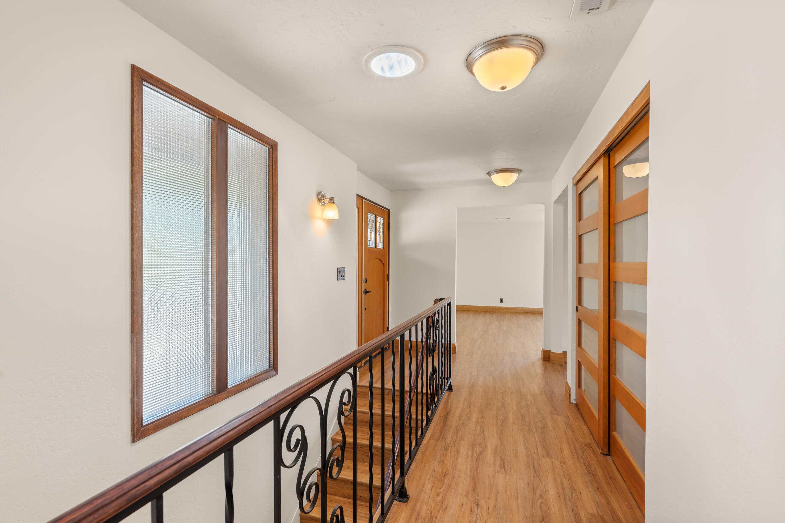 3583 Ross Lane Central Point, OR 97502 - Photo 14 of 52 a view of a hallway with wooden floor and door