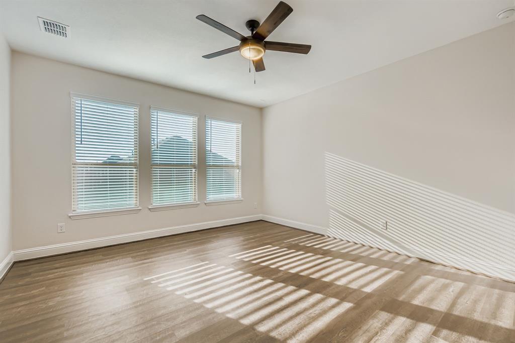 312 Magnolia Drive Oak Point, TX 75068 - Photo 22 of 28 Spare room with wood finished floors and ceiling fan