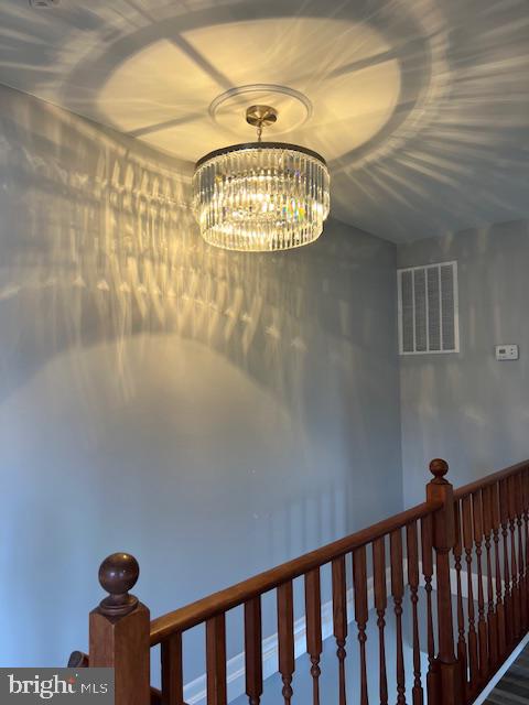 206 Stevens Road Middle River, MD 21220 - Photo 22 of 31 Elegant chandelier casting shadows.