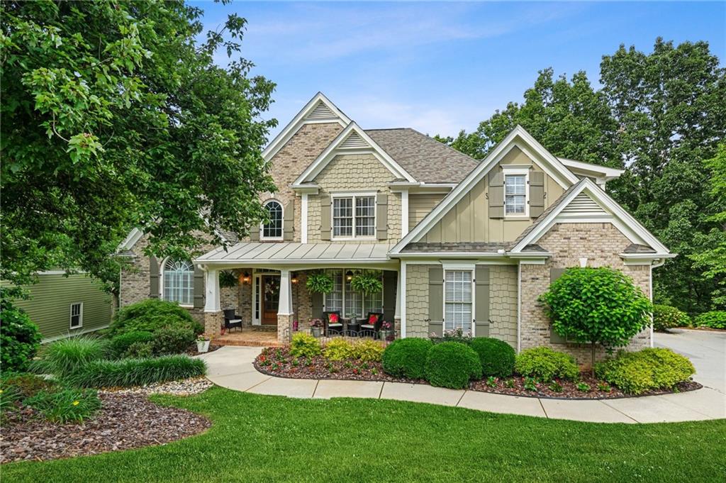 509 Crested Hawk Ridge Canton, GA 30114 - Photo 1 of 89 a front view of a house with a yard and green space