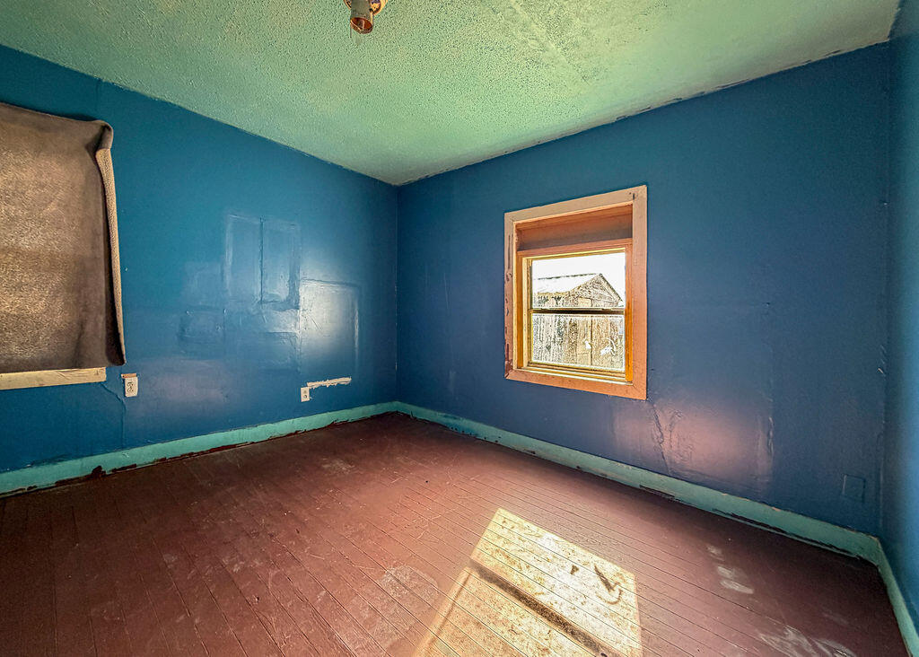 1204 Galveston Plainview, TX 79072 - Photo 10 of 12 a view of an empty room with a window