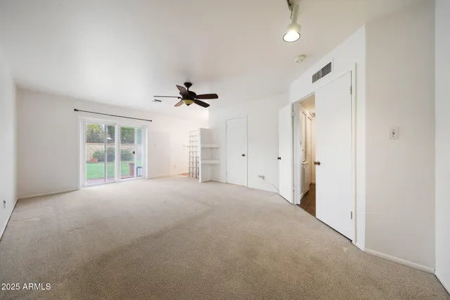 a view of an empty room with a window