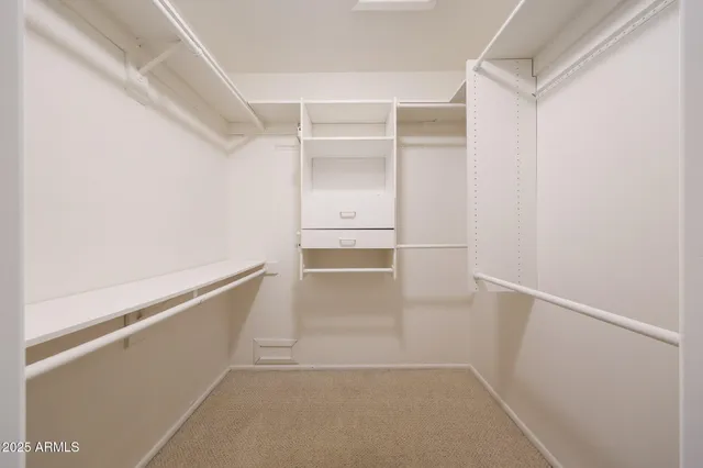 a view of an empty walk in closet