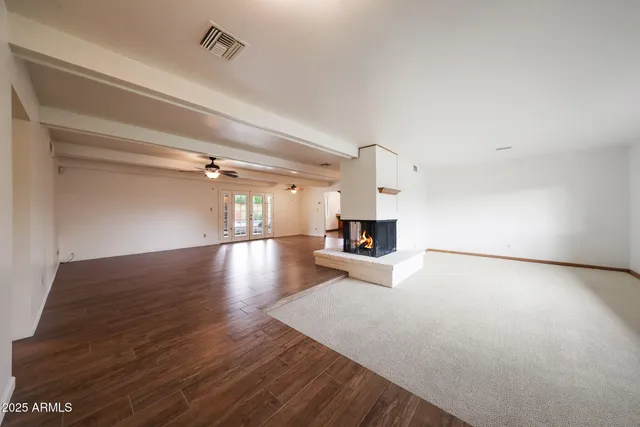 a view of a livingroom with wooden floor