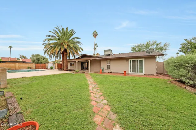a front view of house with yard and seating area