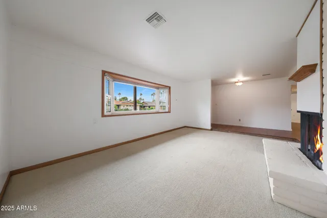 a view of an empty room with a tv