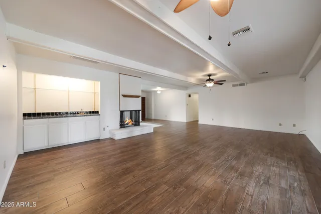 a view of a kitchen with a sink and a window
