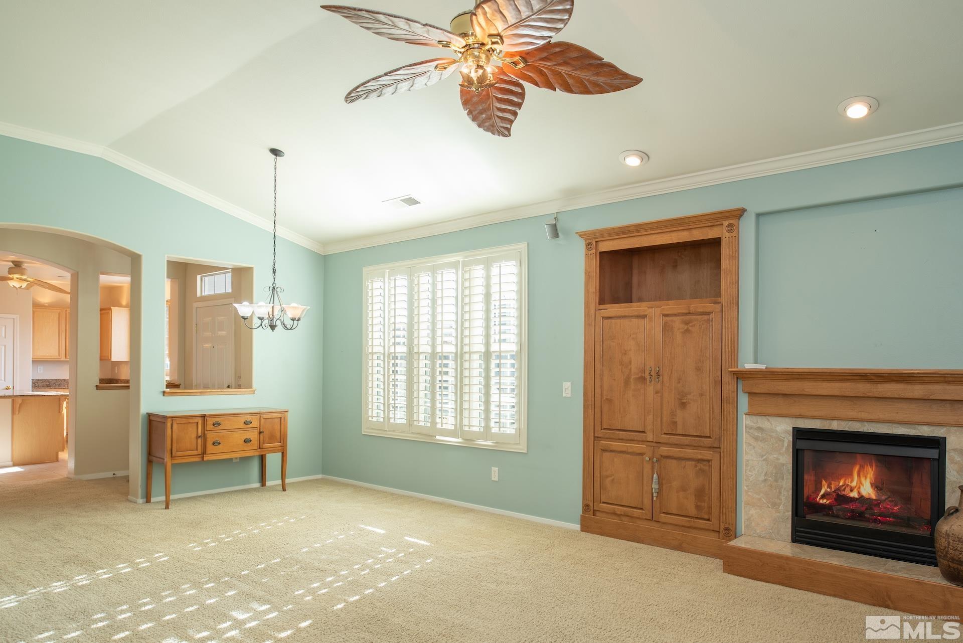 10175 Donner Peak Drive Reno, NV 89521 - Photo 11 of 35 a view of livingroom with window fireplace and cabinet