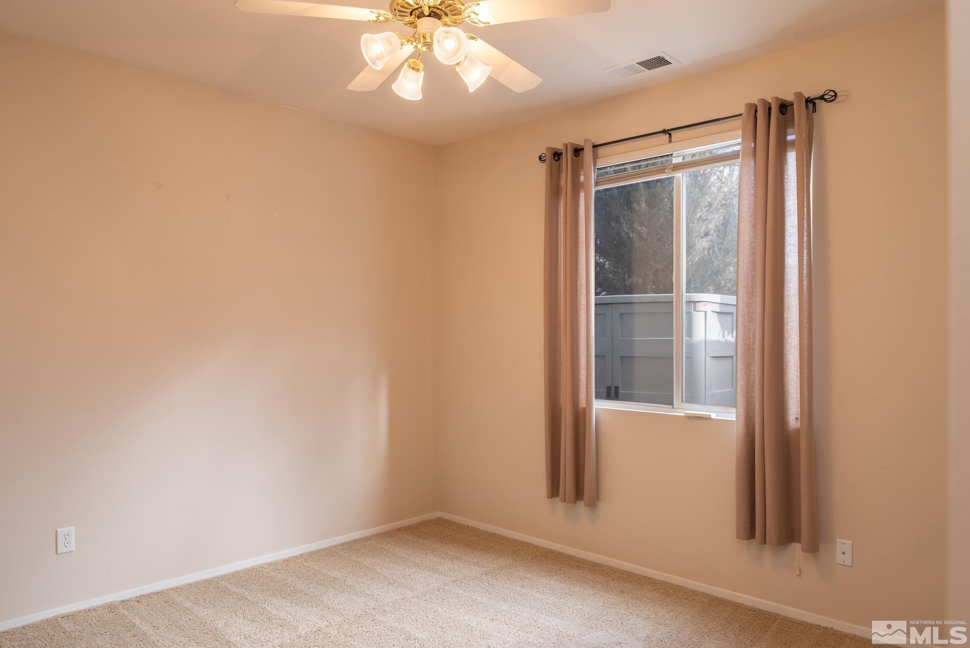 10175 Donner Peak Drive Reno, NV 89521 - Photo 24 of 35 an empty room with a window