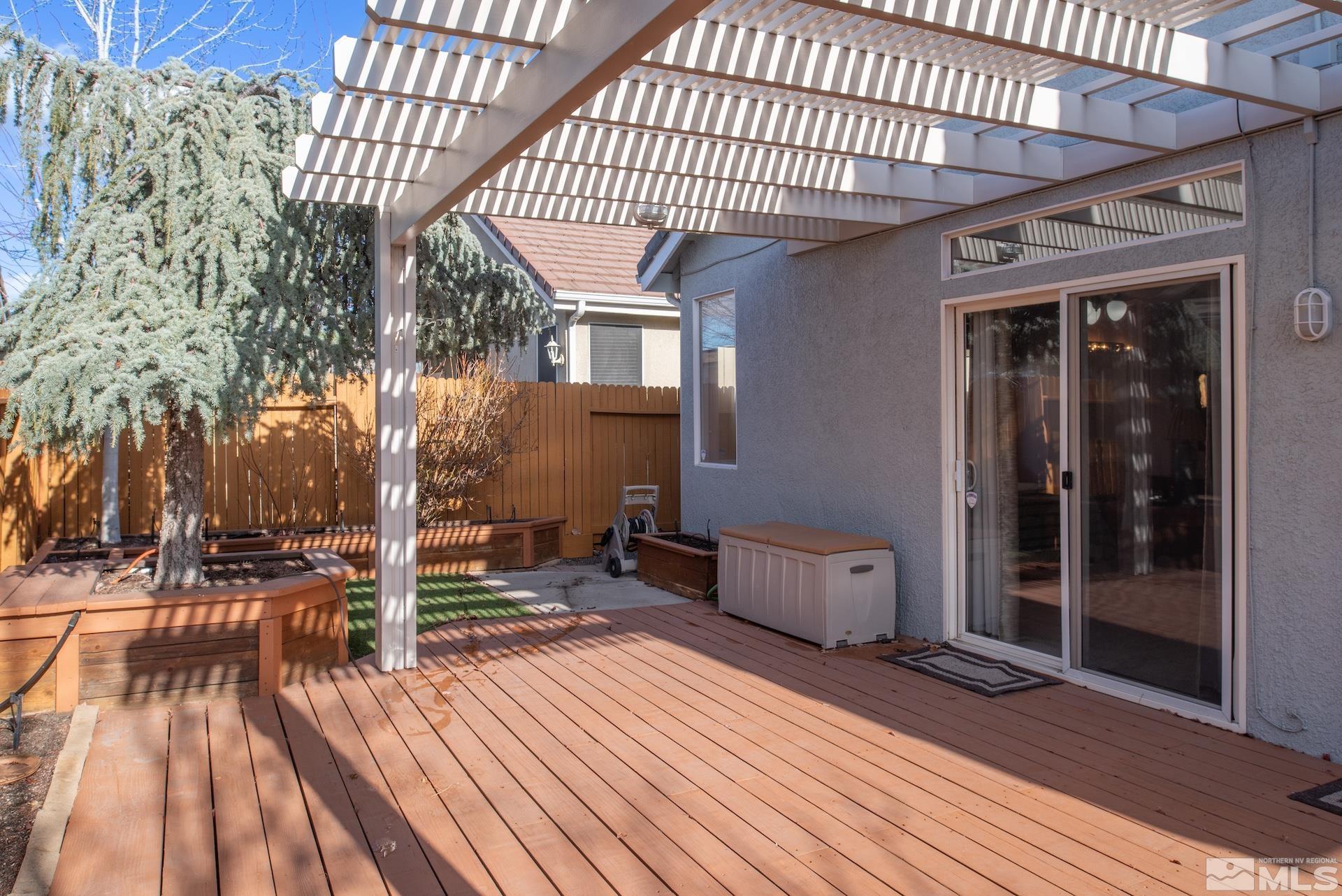 10175 Donner Peak Drive Reno, NV 89521 - Photo 26 of 35 a porch with seating space and hardwood floor