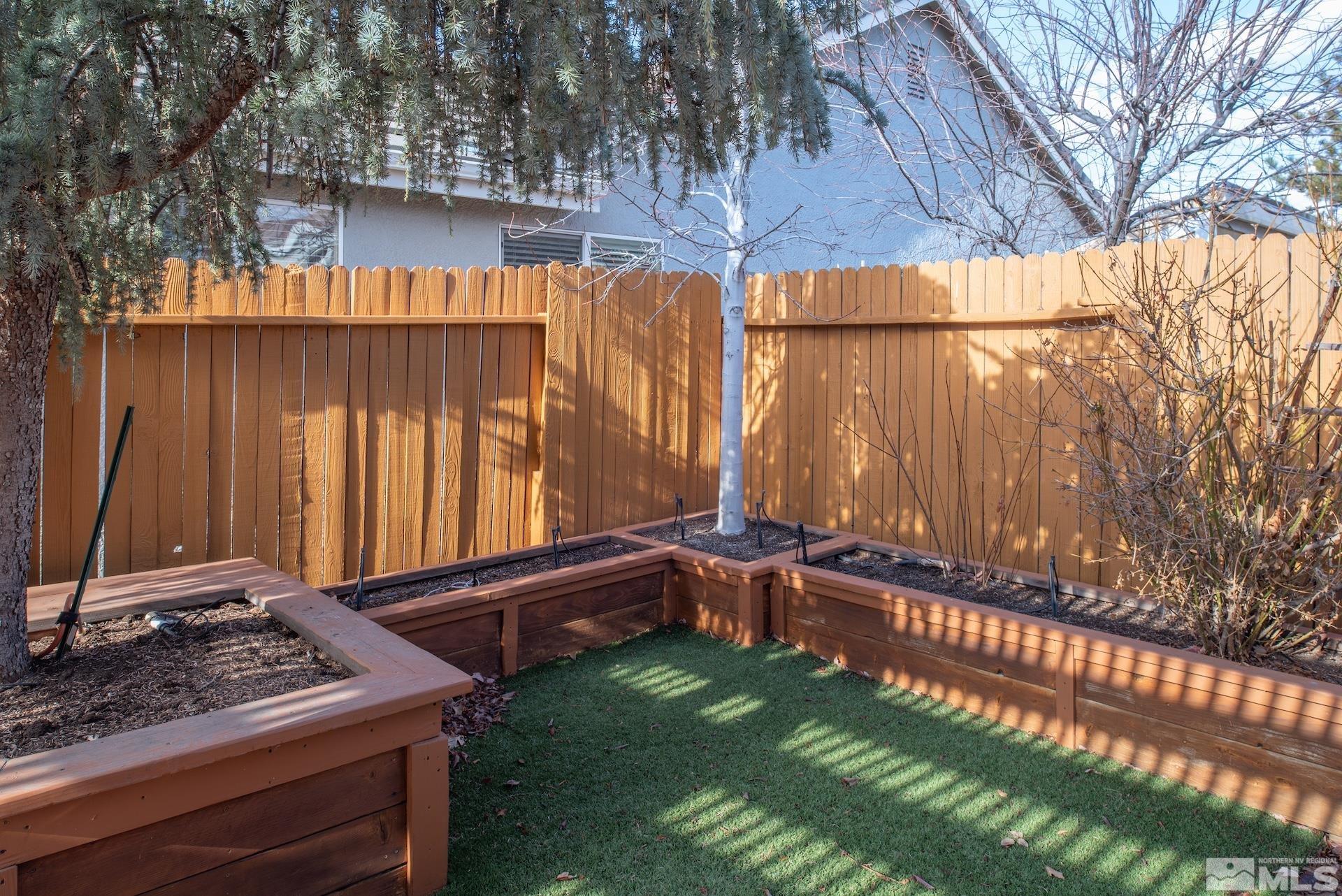 10175 Donner Peak Drive Reno, NV 89521 - Photo 27 of 35 a backyard of a house with a yard and outdoor seating