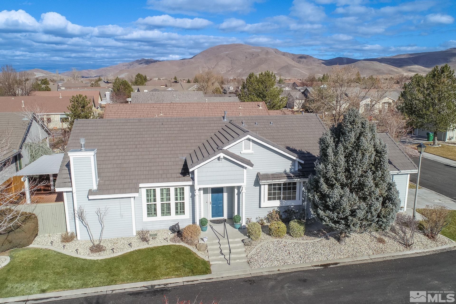 10175 Donner Peak Drive Reno, NV 89521 - Photo 6 of 35 a front view of a house with a yard