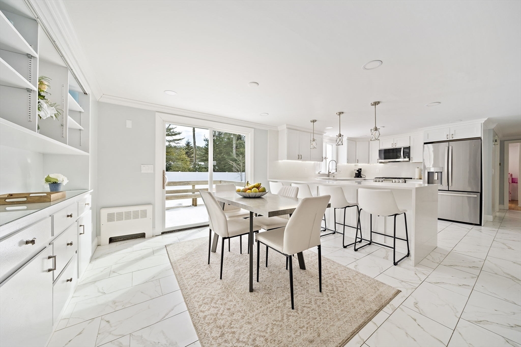10 Dowd Avenue Wareham, MA 02571 - Photo 11 of 42 a view of a dining room with furniture and a kitchen