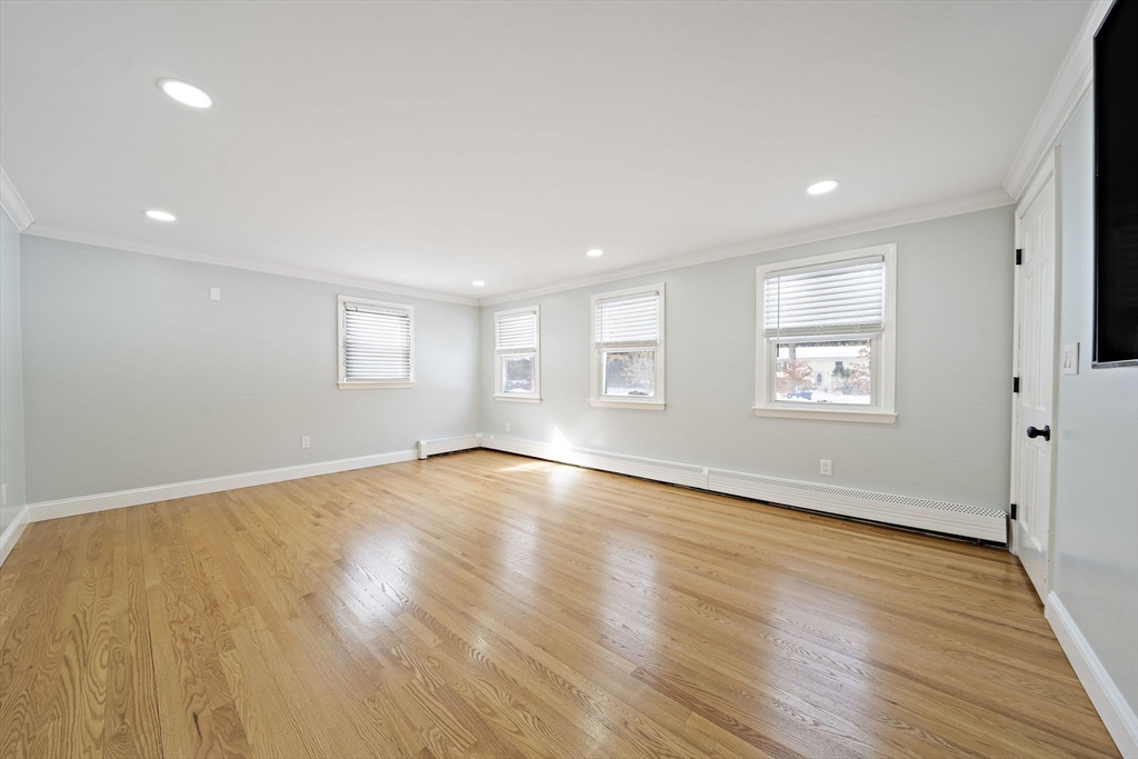 10 Dowd Avenue Wareham, MA 02571 - Photo 18 of 42 an empty room with wooden floor and windows