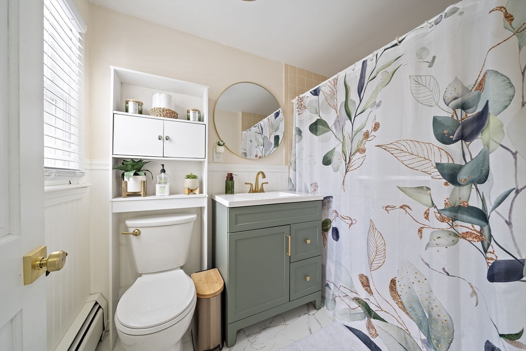 10 Dowd Avenue Wareham, MA 02571 - Photo 24 of 42 a bathroom with a toilet sink and mirror