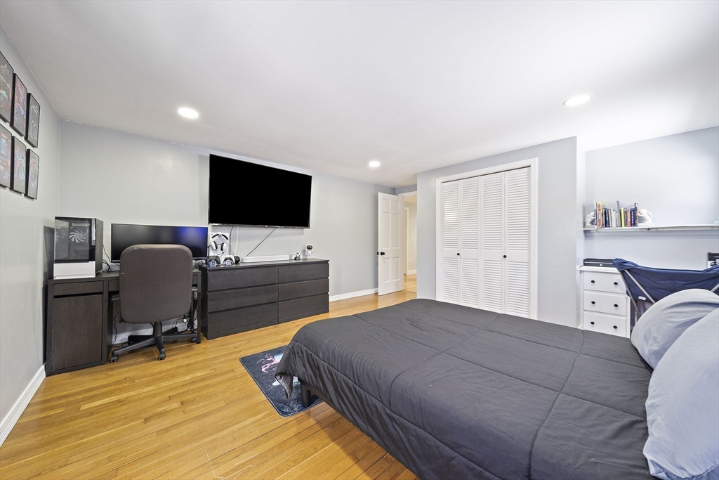 10 Dowd Avenue Wareham, MA 02571 - Photo 26 of 42 a bedroom with a bed and a flat screen tv