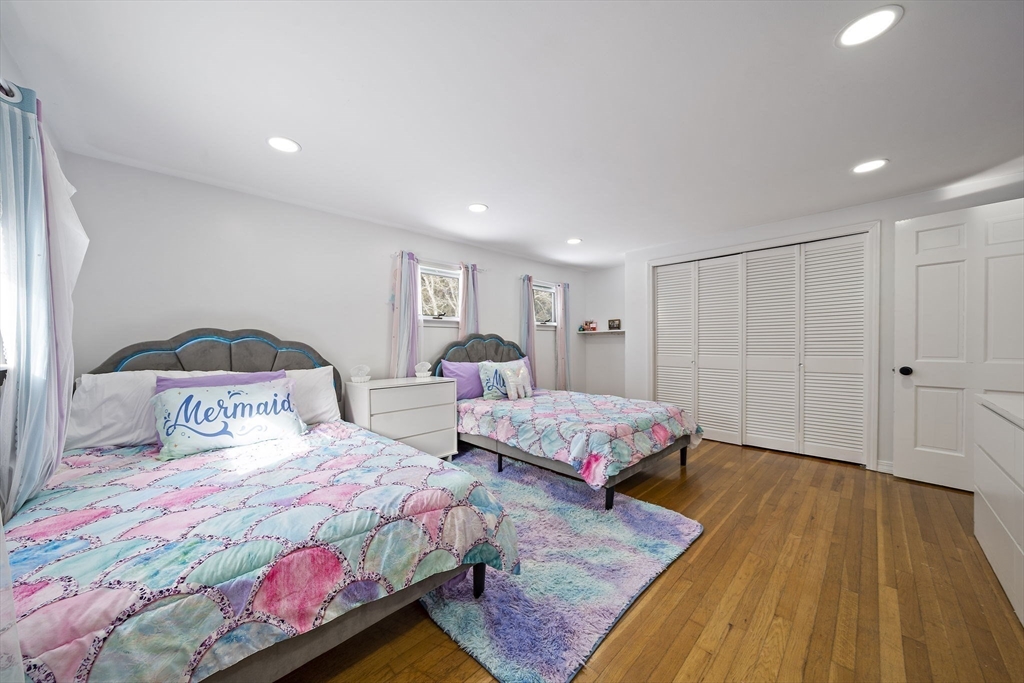 10 Dowd Avenue Wareham, MA 02571 - Photo 30 of 42 a bedroom with two beds and a chandelier