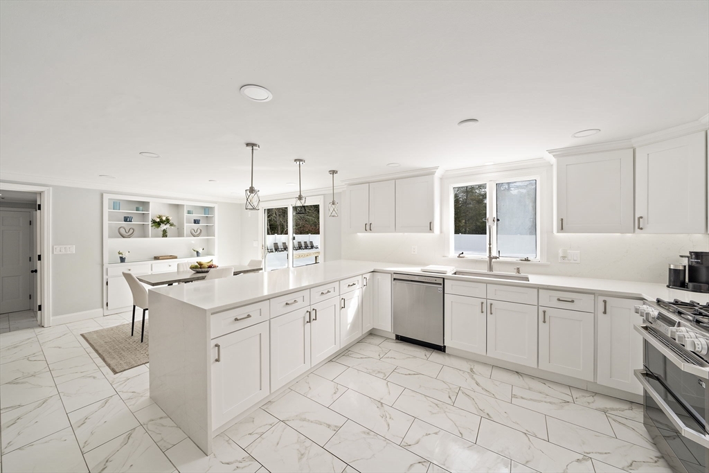 10 Dowd Avenue Wareham, MA 02571 - Photo 7 of 42 a kitchen with cabinets appliances and a sink