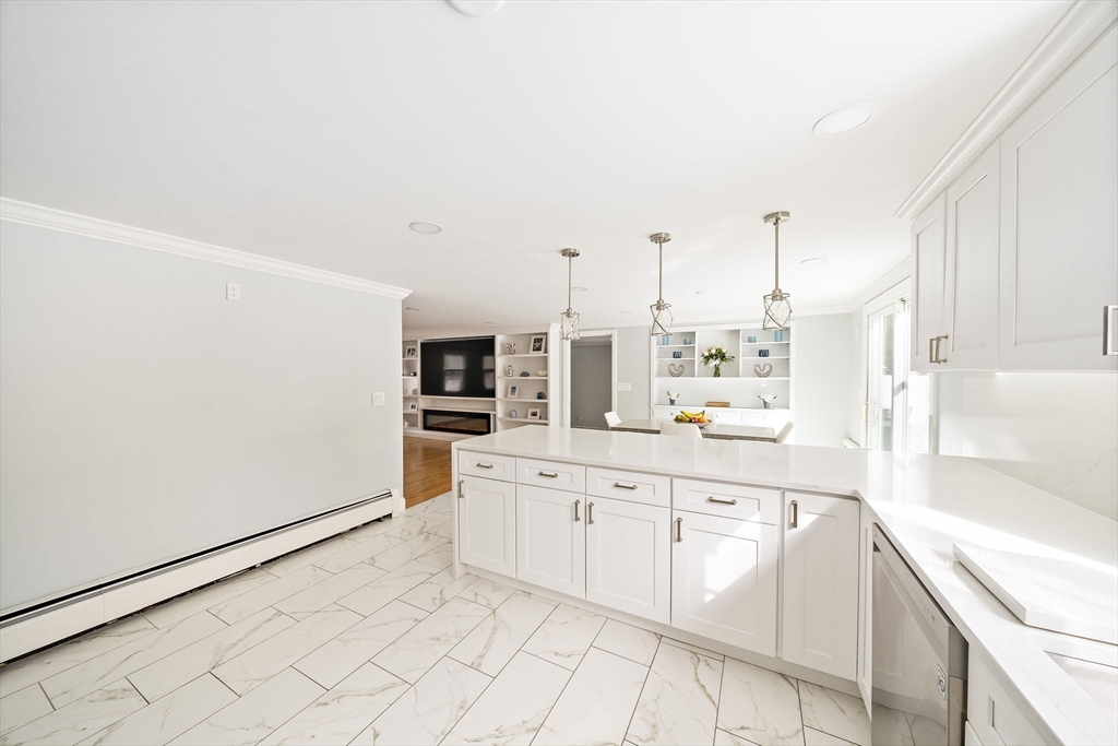 10 Dowd Avenue Wareham, MA 02571 - Photo 8 of 42 a large white kitchen with cabinets