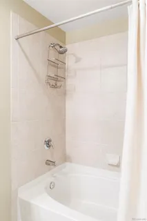 a bathroom with a white bath tub