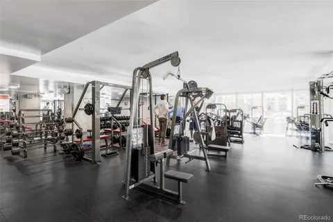 a tall building sitting next to a city view