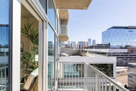 a balcony of a house with wooden floor and outdoor space