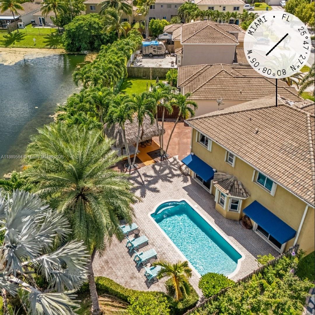 21059 Southwest 90th Place Cutler Bay, FL 33189 - Photo 19 of 20 an aerial view of a house with a yard and lake view
