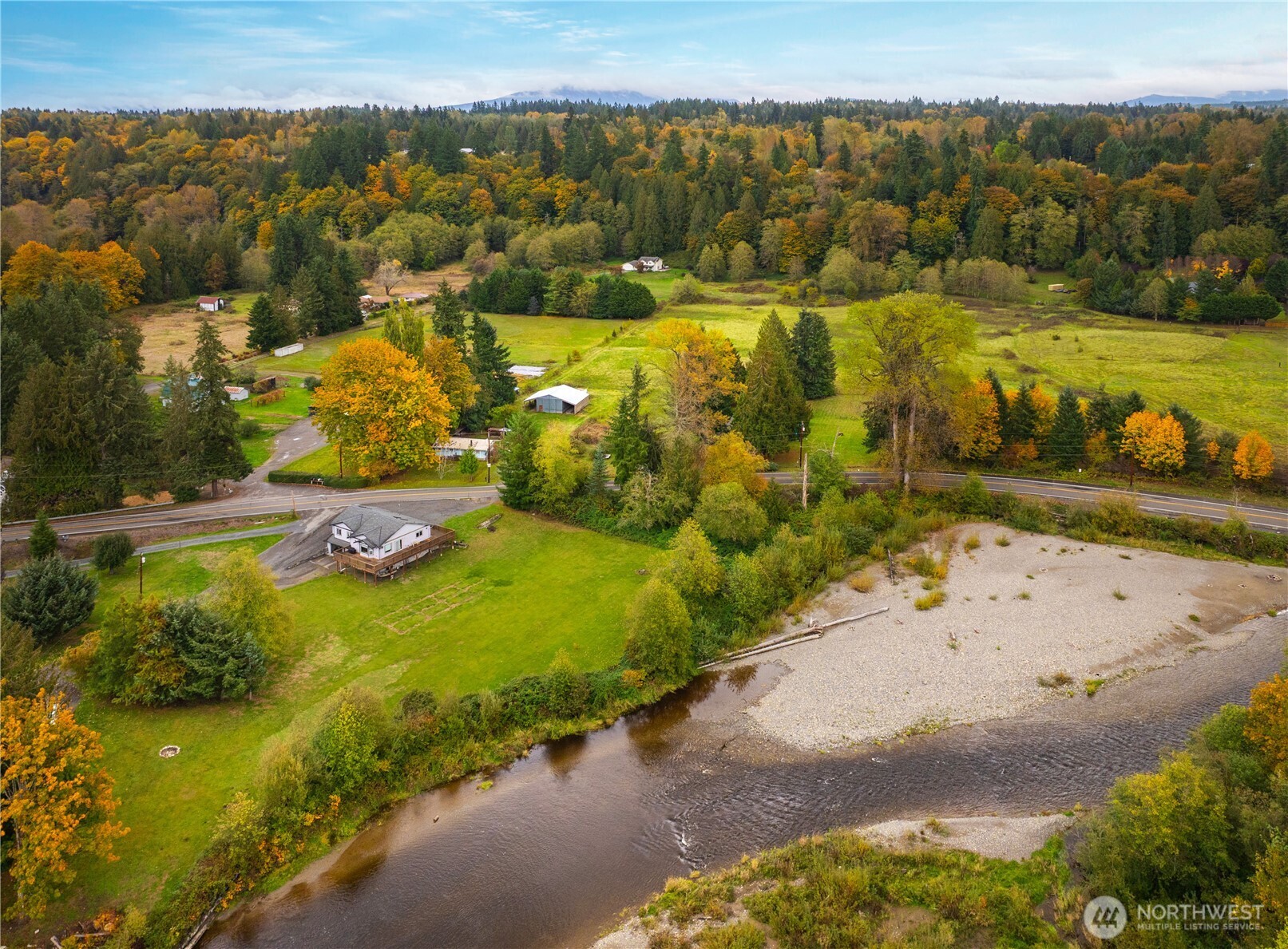 921 Russell Road Snohomish, WA 98290 - Photo 3 of 15 a view of a lake with beach and mountain view